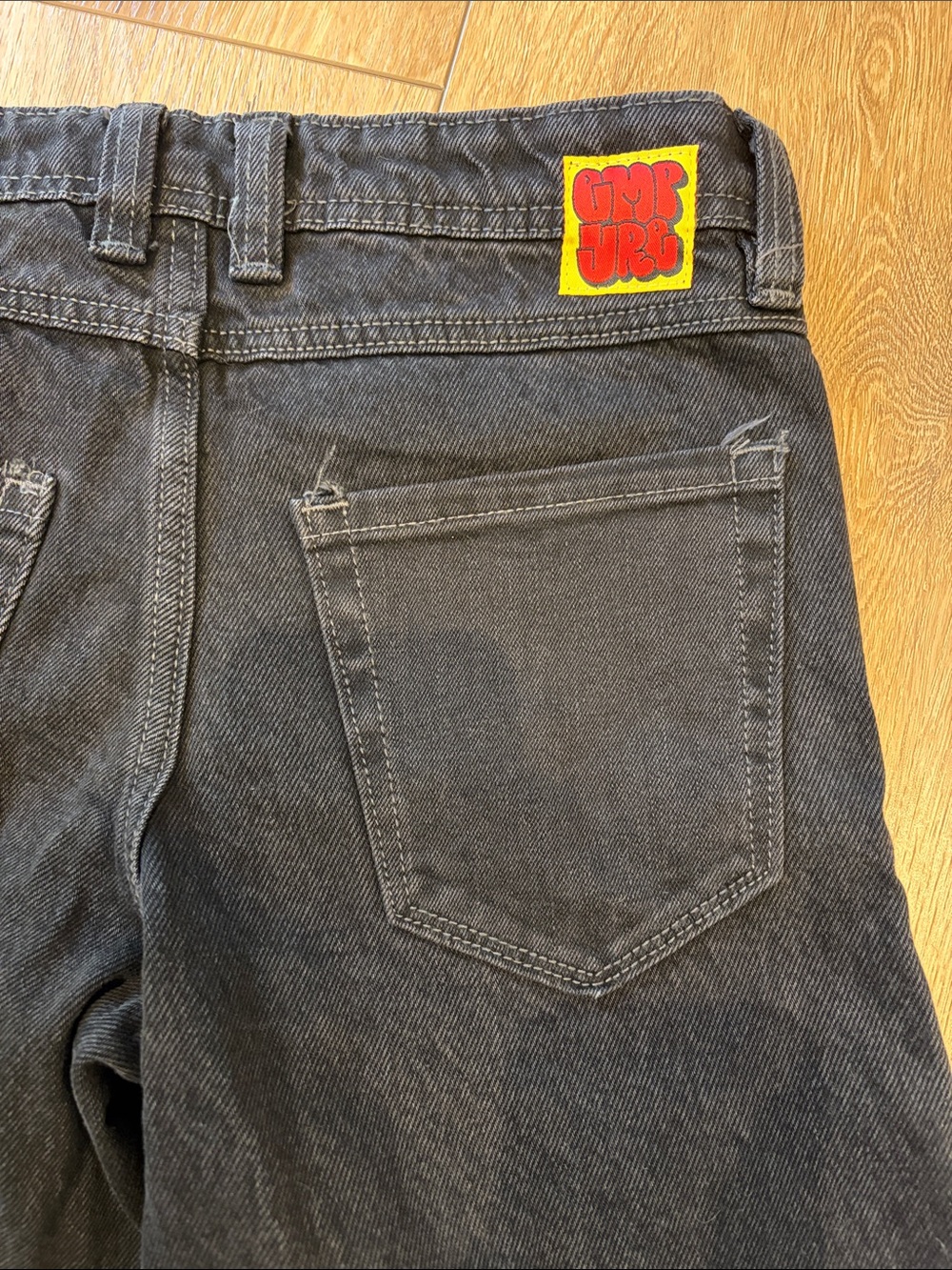 Empyre Kids Black Denim Jeans with Yellow & Red Logo Patch